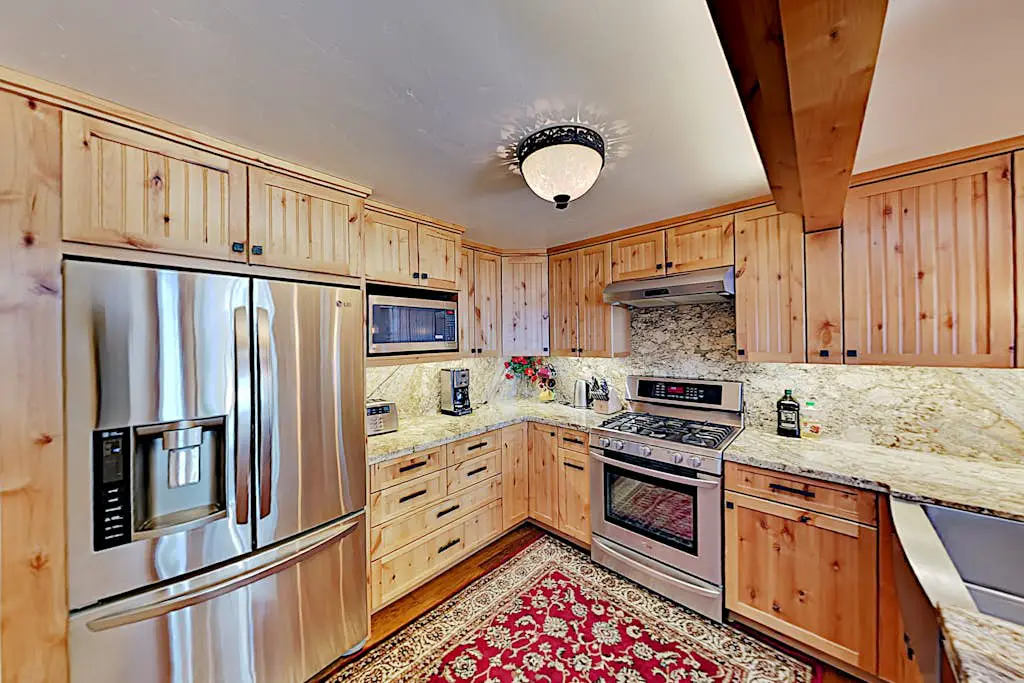 Custom, luxe condo with panoramic lake & mountain views & fireplaces