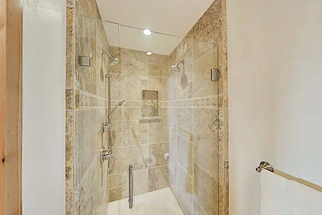 Custom, luxe condo with panoramic lake & mountain views & fireplaces