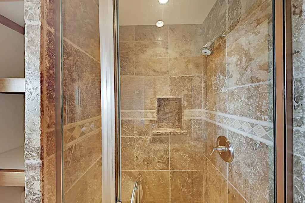 Custom, luxe condo with panoramic lake & mountain views & fireplaces