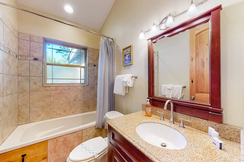 Dog-friendly home near lake with hot tub, pool table, fireplace, & W&D