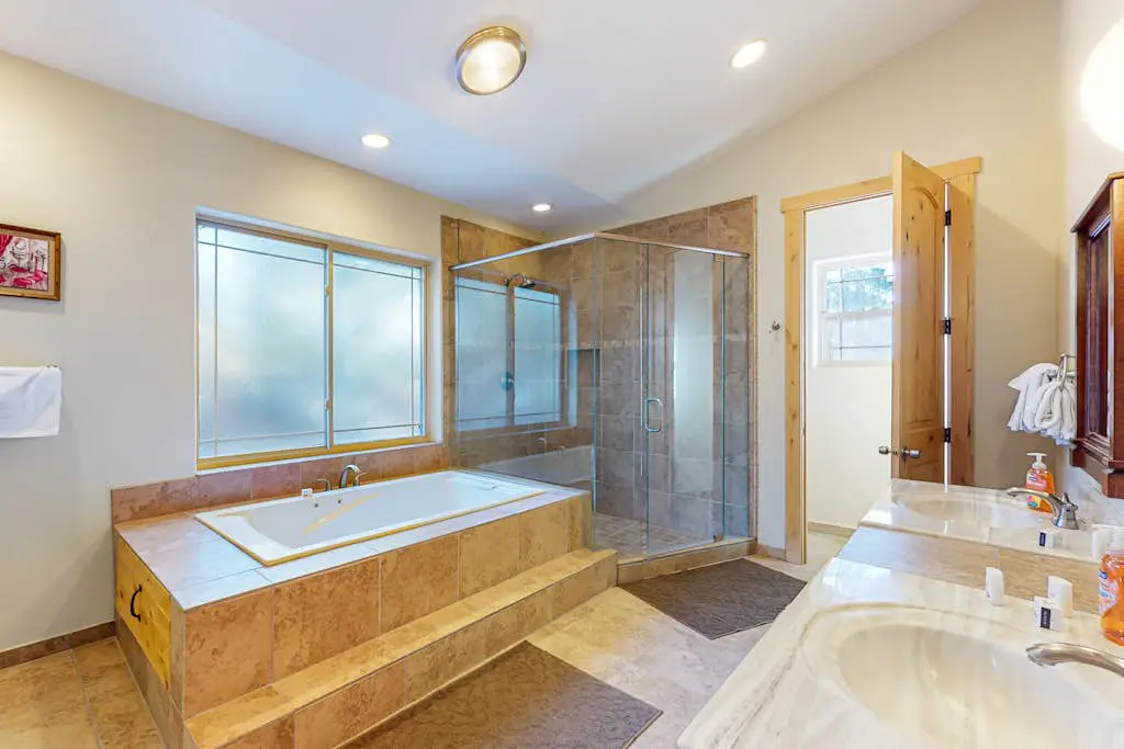 Dog-friendly home near lake with hot tub, pool table, fireplace, & W&D