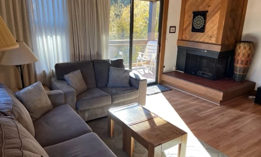 Condo with fireplace, balcony, washer/dryer, hot tub, & basketball/tennis courts