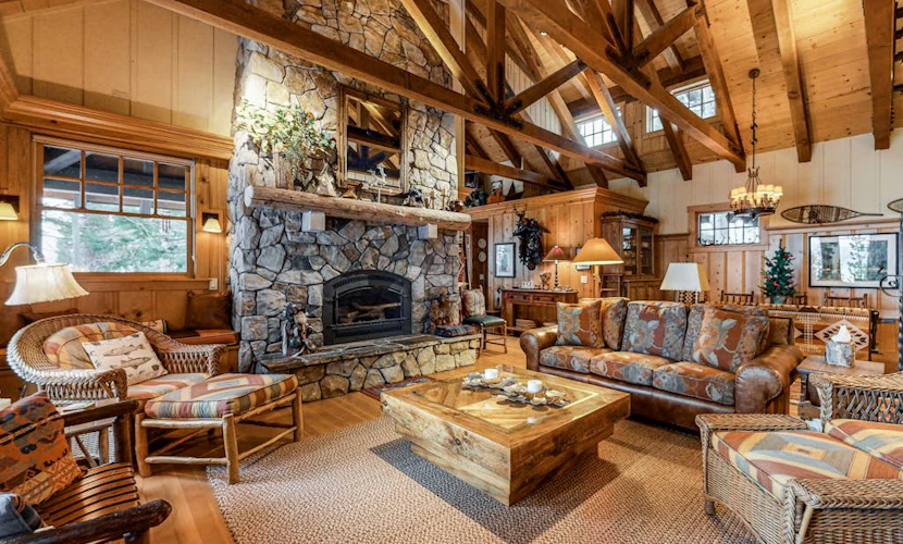 Beautiful lakefront home with dock, stone fireplace, W/D, and nearby activities
