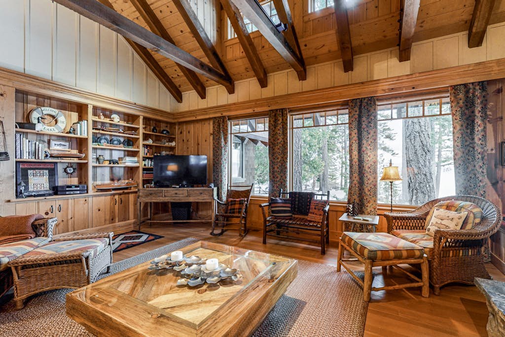 Beautiful lakefront home with dock, stone fireplace, W/D, and nearby activities