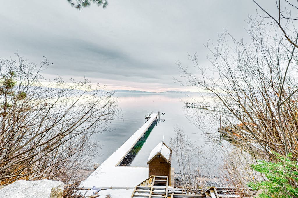 Beautiful lakefront home with dock, stone fireplace, W&D, and nearby activities