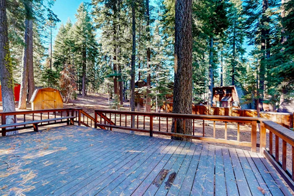 Two-story cabin with a wood fireplace, washer/dryer, & decks