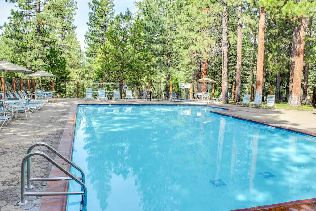 Inviting condo with balconies, fireplace, outdoor pool, sauna, & fitness center