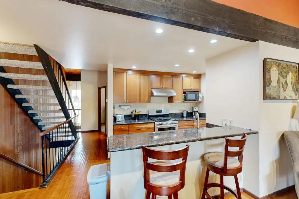 Inviting condo with balconies, fireplace, outdoor pool, sauna, & fitness center