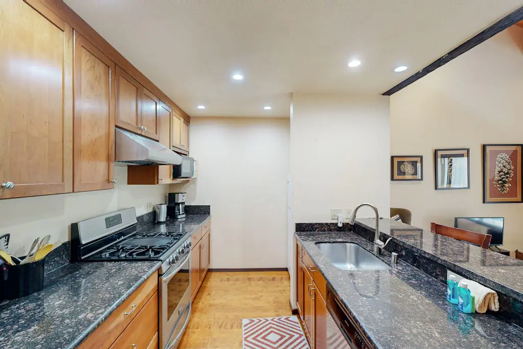 Inviting condo with balconies, fireplace, outdoor pool, sauna, & fitness center