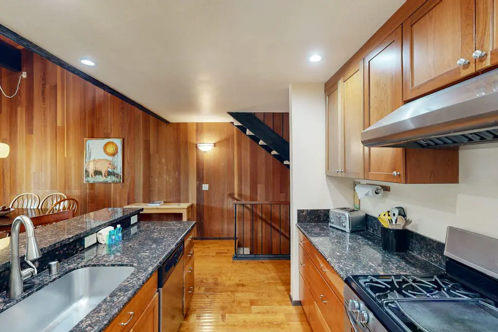 Inviting condo with balconies, fireplace, outdoor pool, sauna, & fitness center
