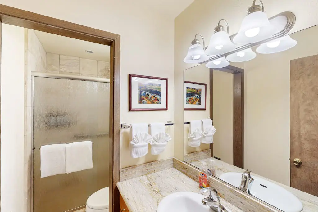 Inviting condo with balconies, fireplace, outdoor pool, sauna, & fitness center