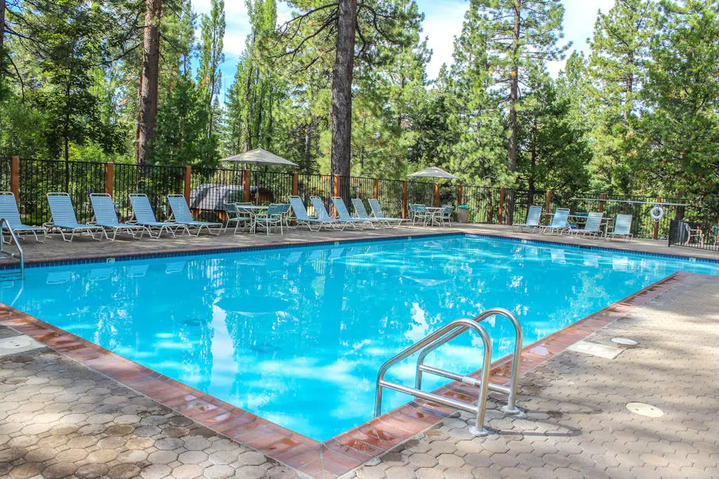 Inviting condo with balconies, fireplace, outdoor pool, sauna, & fitness center