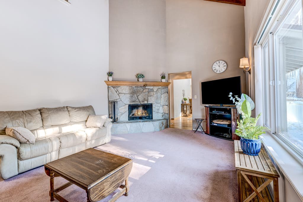 Peaceful retreat with a gas fireplace, balcony, & washer&dryer