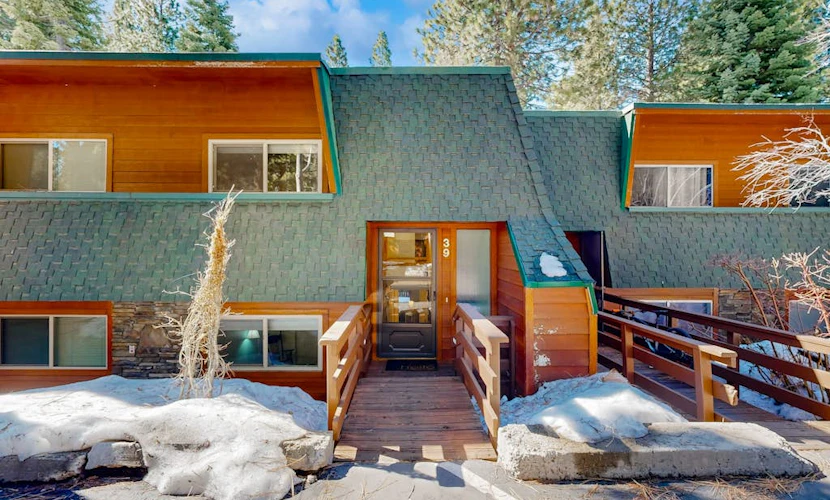 Forest-view condo with wood fireplace & walkable locale - dog-friendly