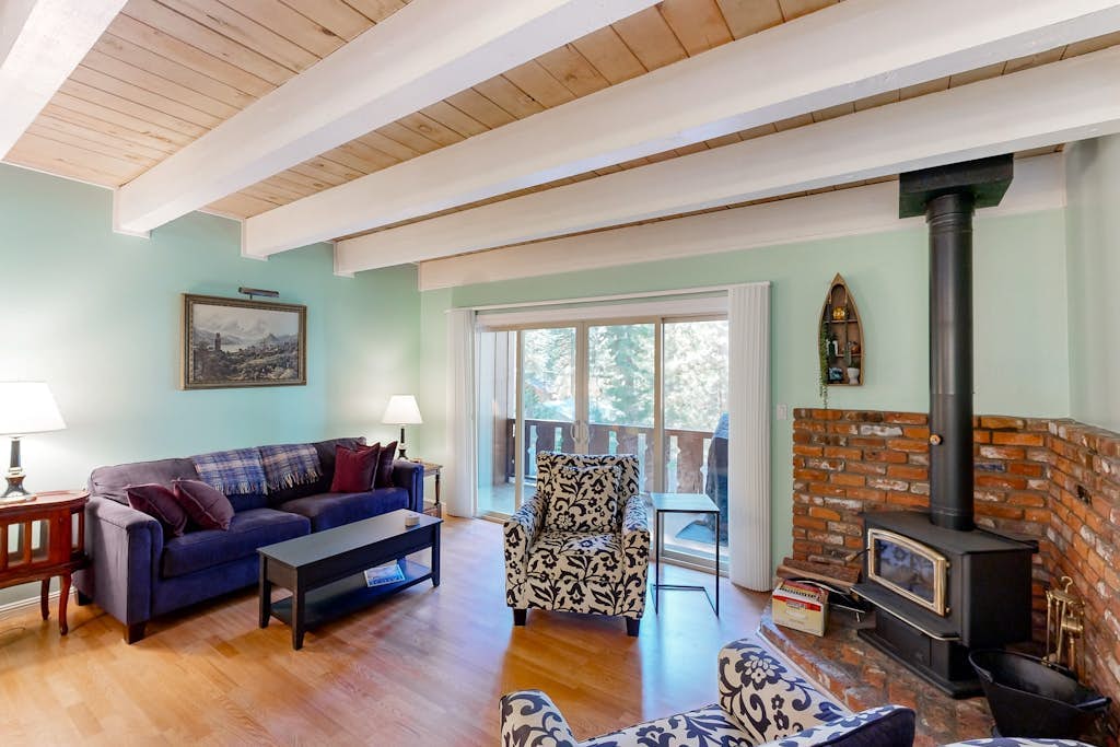 Forest-view condo with wood fireplace & walkable locale - dog-friendly