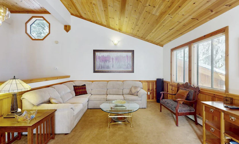 Rustic home with wood stove, deck, open floor plan, & nearby activities