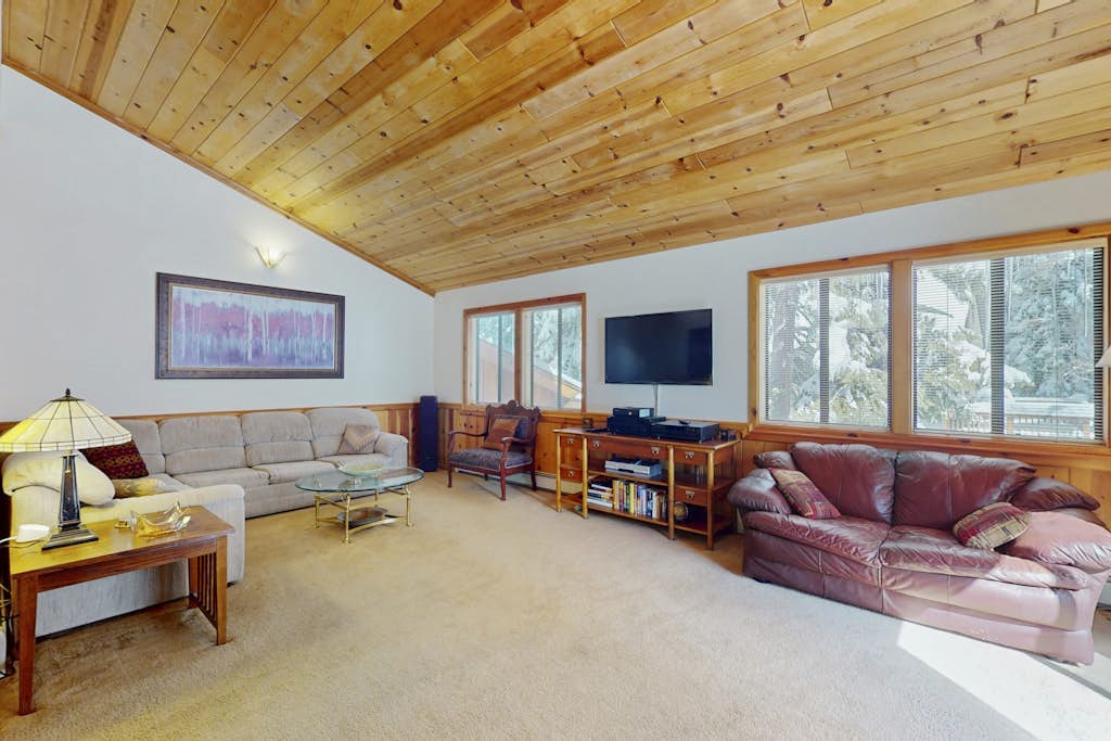 Rustic home with wood stove, deck, open floor plan, & nearby activities