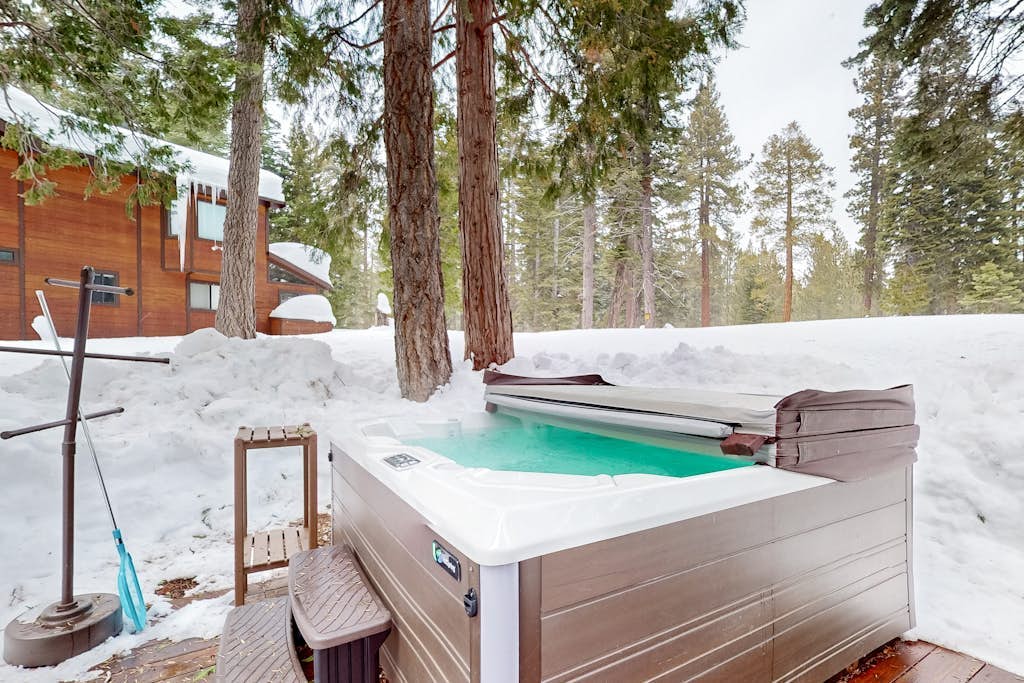 Welcoming lake retreat with private hot tub, games, & fireplace - dog-friendly