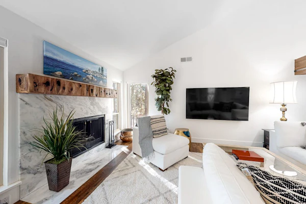 Renovated 2nd-floor condo with deck, grill, fireplace, W/D, & free WiFi