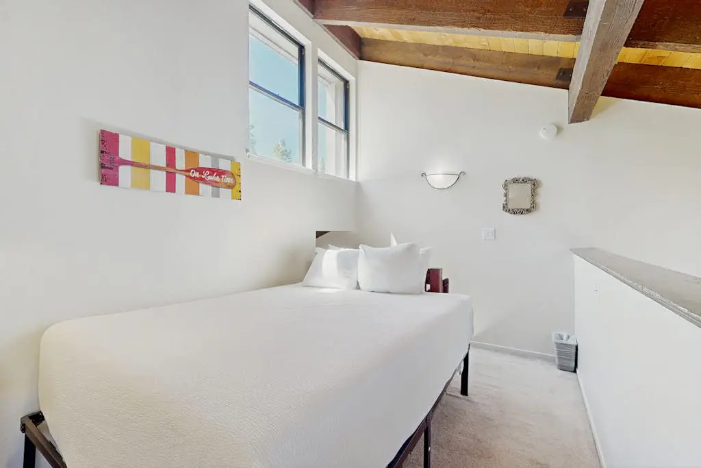 Let reality drift away with the lake view at this townhome with a private beach