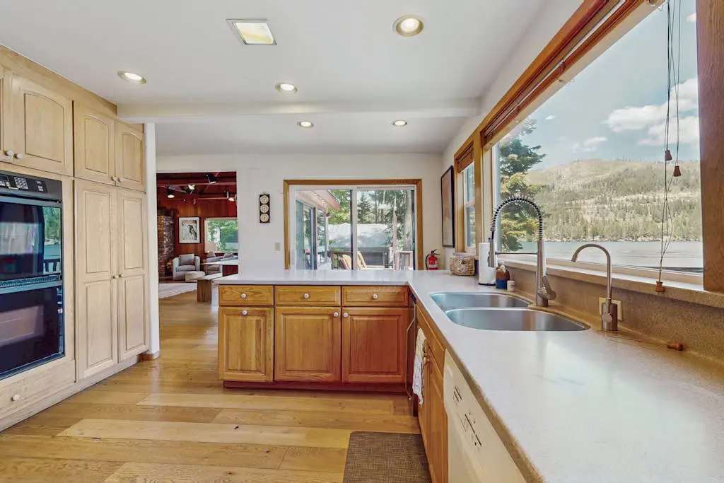Terrific lakefront gem with private hot tub, dock & beach - near skiing & town