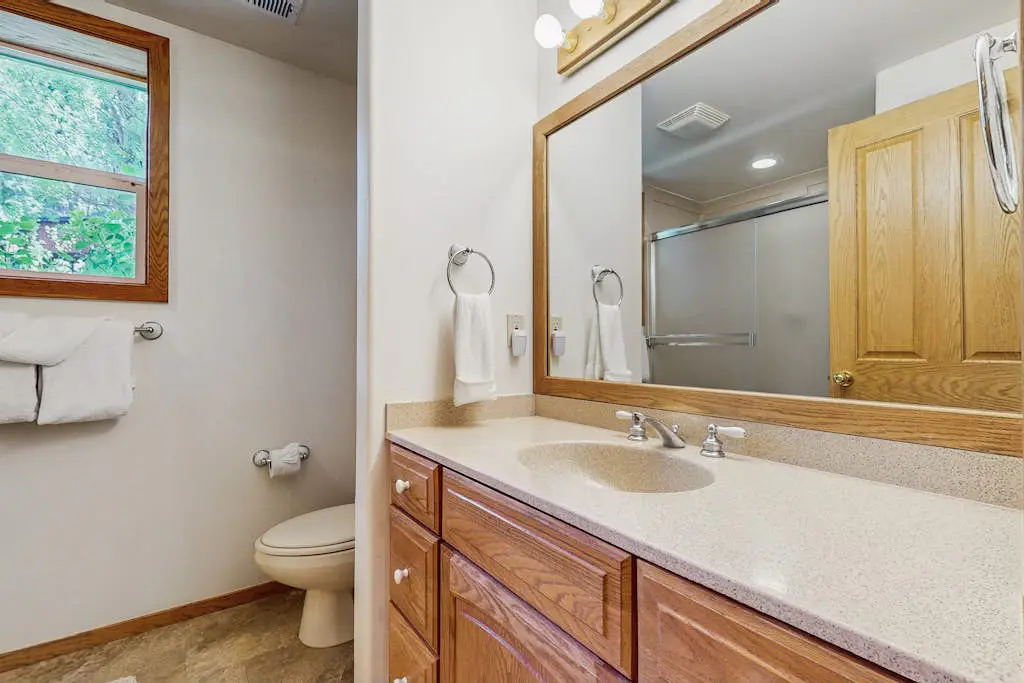 Terrific lakefront gem with private hot tub, dock & beach - near skiing & town