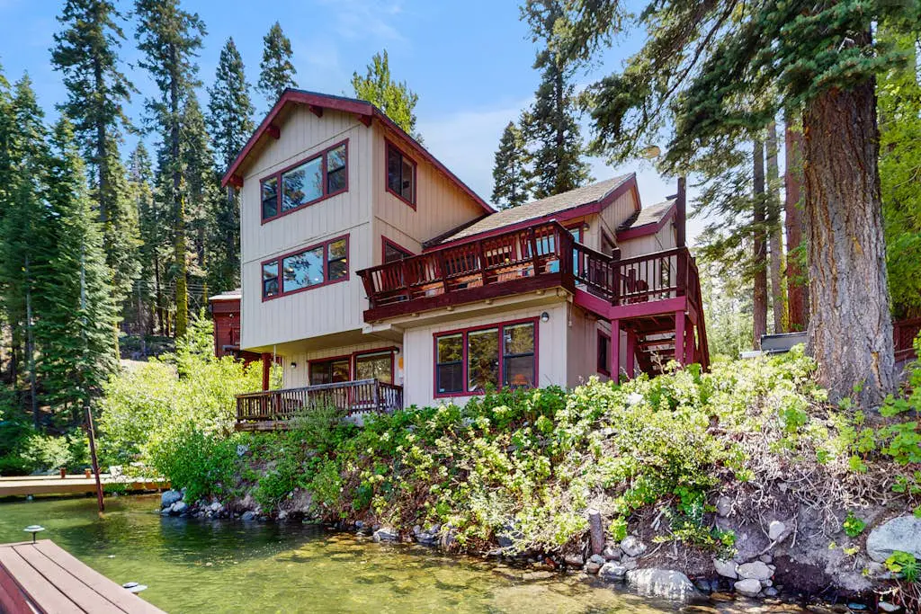 Terrific lakefront gem with private hot tub, dock & beach - near skiing & town