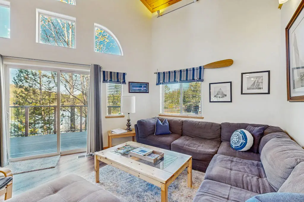 Family-friendly, lakefront getaway with a gas fireplace, furnished deck, & views