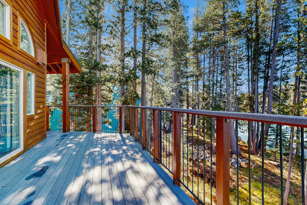 Family-friendly, lakefront getaway with a gas fireplace, furnished deck, & views