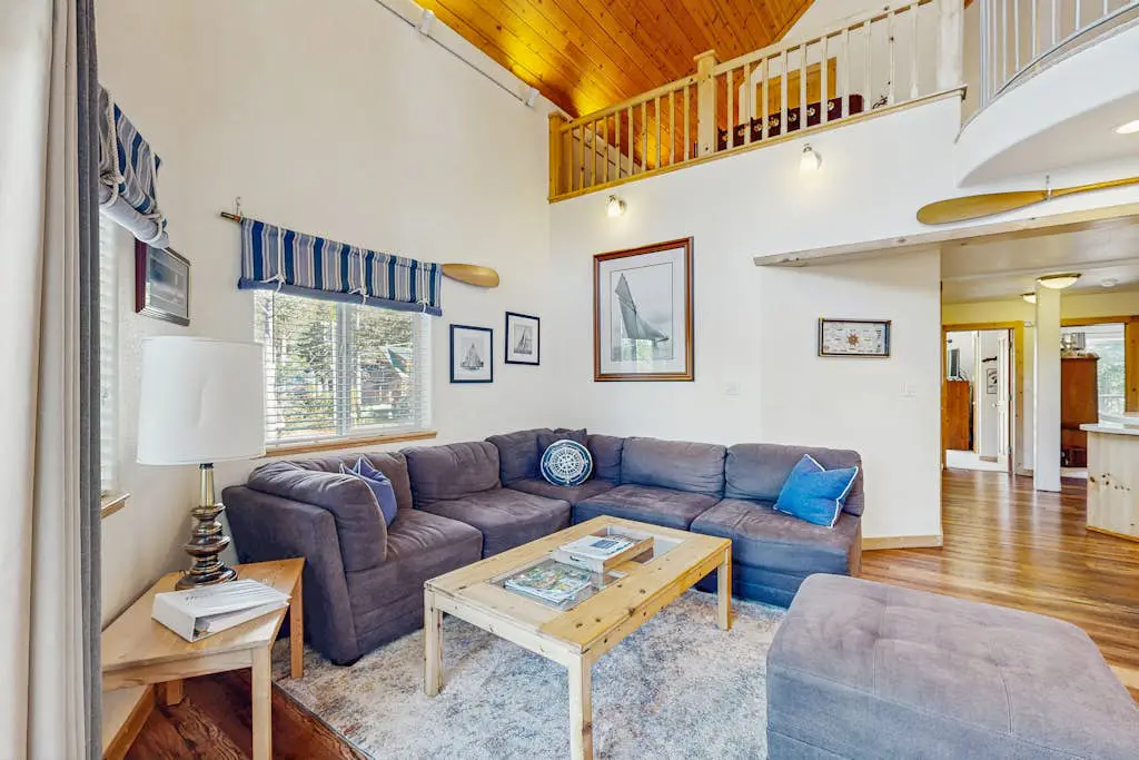 Family-friendly, lakefront getaway with a gas fireplace, furnished deck, & views