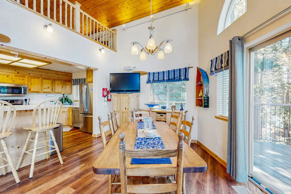Family-friendly, lakefront getaway with a gas fireplace, furnished deck, & views