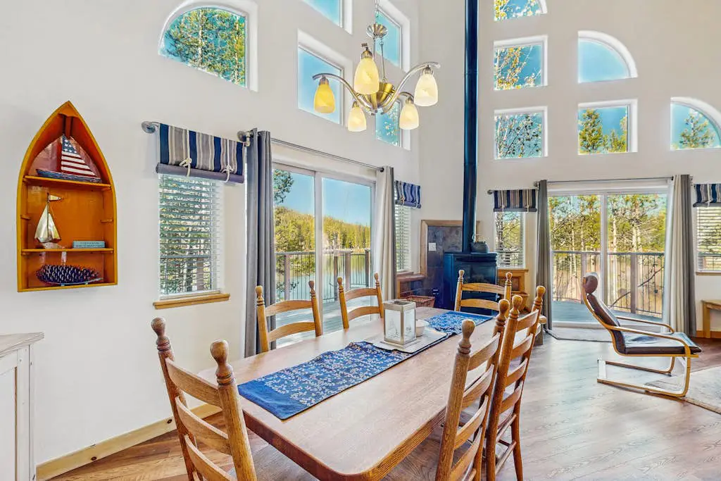 Family-friendly, lakefront getaway with a gas fireplace, furnished deck, & views
