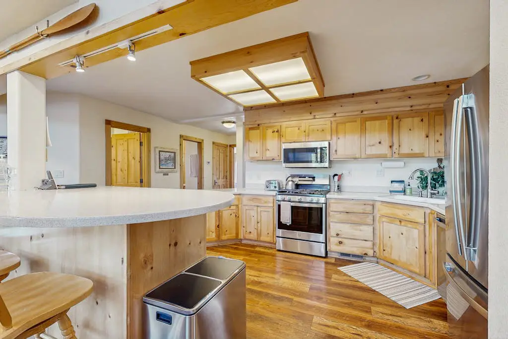 Family-friendly, lakefront getaway with a gas fireplace, furnished deck, & views