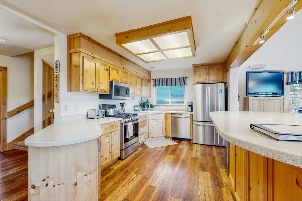 Family-friendly, lakefront getaway with a gas fireplace, furnished deck, & views