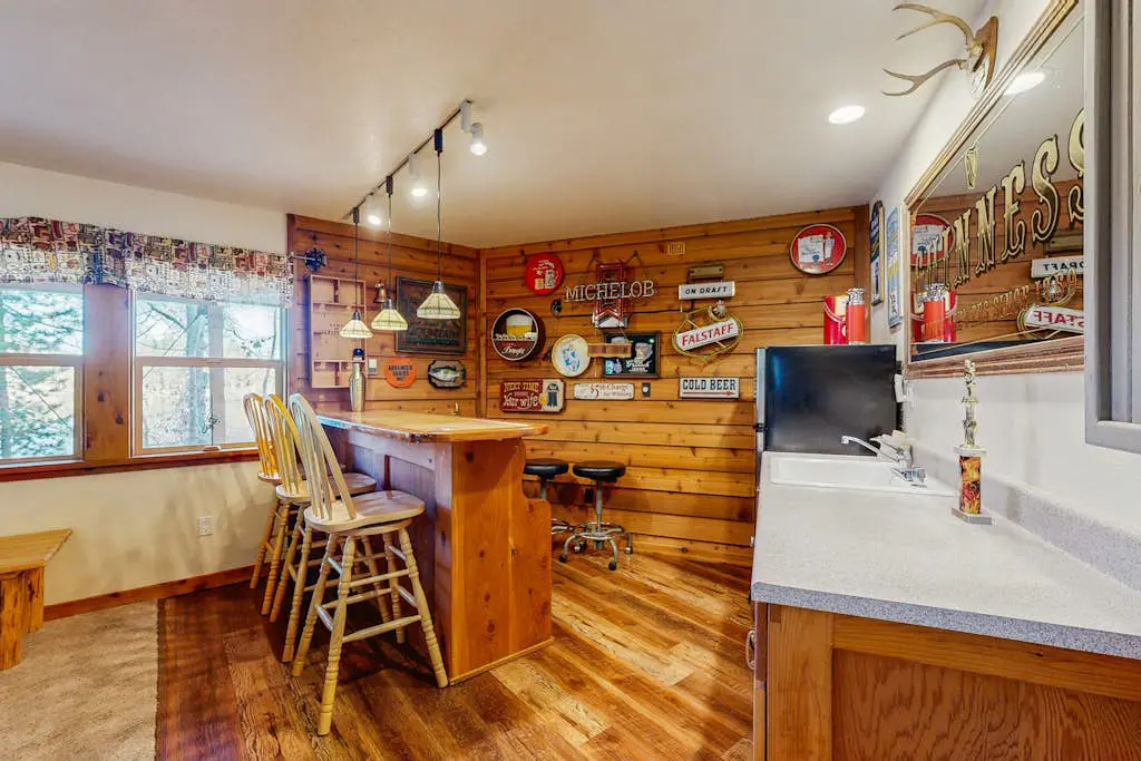 Family-friendly, lakefront getaway with a gas fireplace, furnished deck, & views
