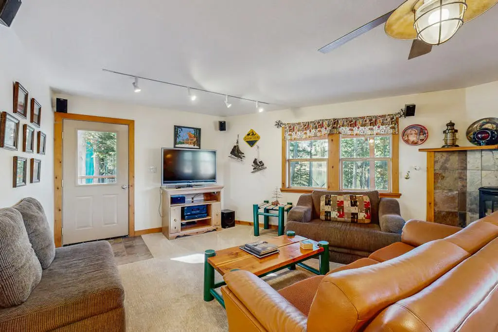 Family-friendly, lakefront getaway with a gas fireplace, furnished deck, & views