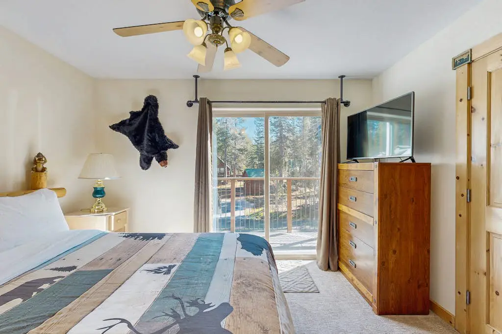 Family-friendly, lakefront getaway with a gas fireplace, furnished deck, & views