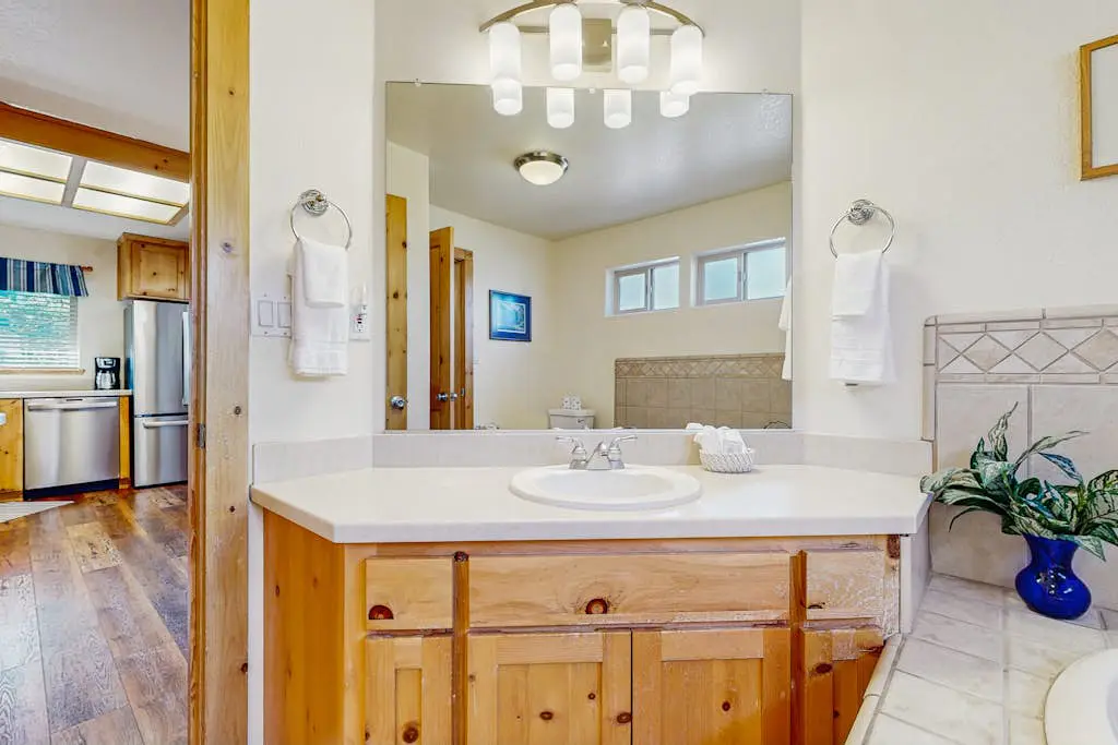 Family-friendly, lakefront getaway with a gas fireplace, furnished deck, & views