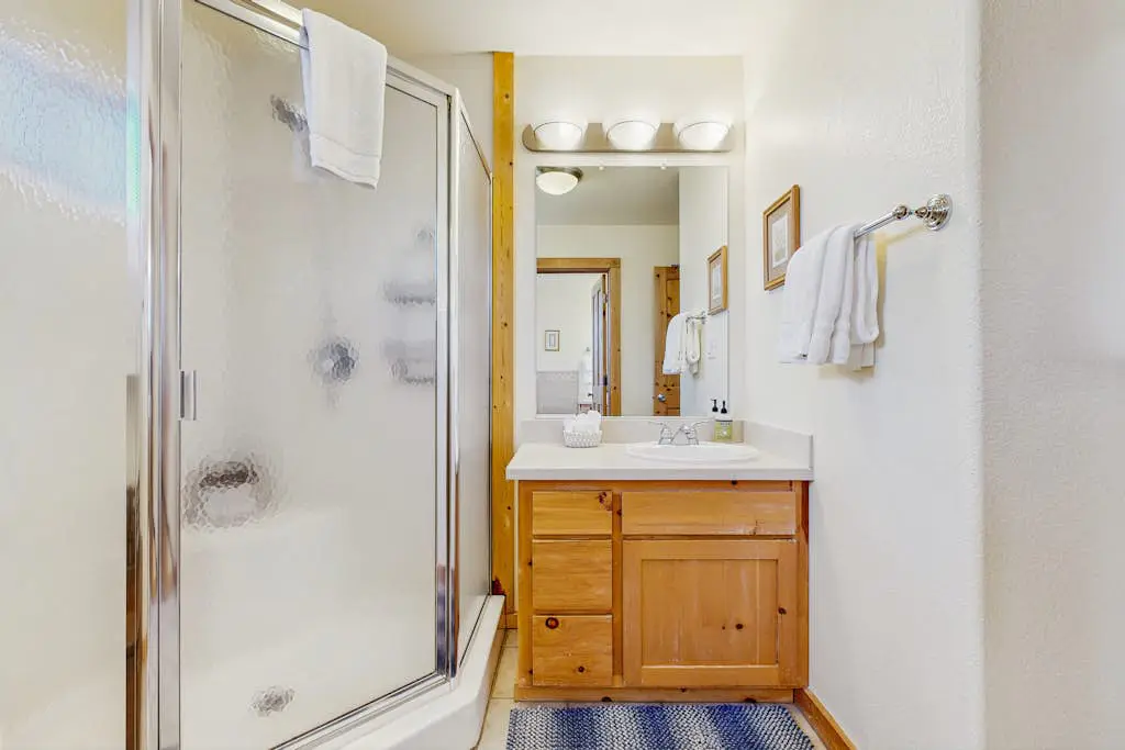 Family-friendly, lakefront getaway with a gas fireplace, furnished deck, & views