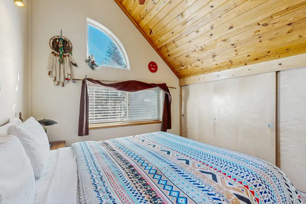 Family-friendly, lakefront getaway with a gas fireplace, furnished deck, & views