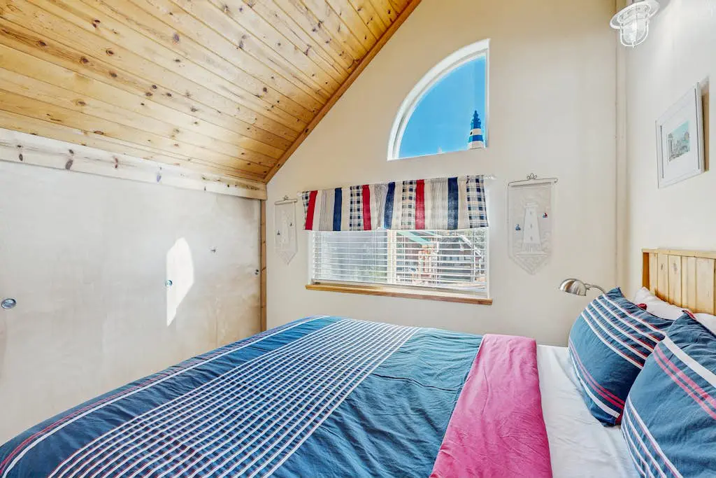 Family-friendly, lakefront getaway with a gas fireplace, furnished deck, & views