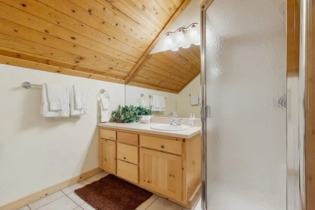 Family-friendly, lakefront getaway with a gas fireplace, furnished deck, & views