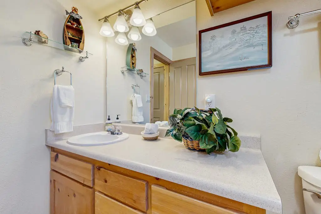 Family-friendly, lakefront getaway with a gas fireplace, furnished deck, & views