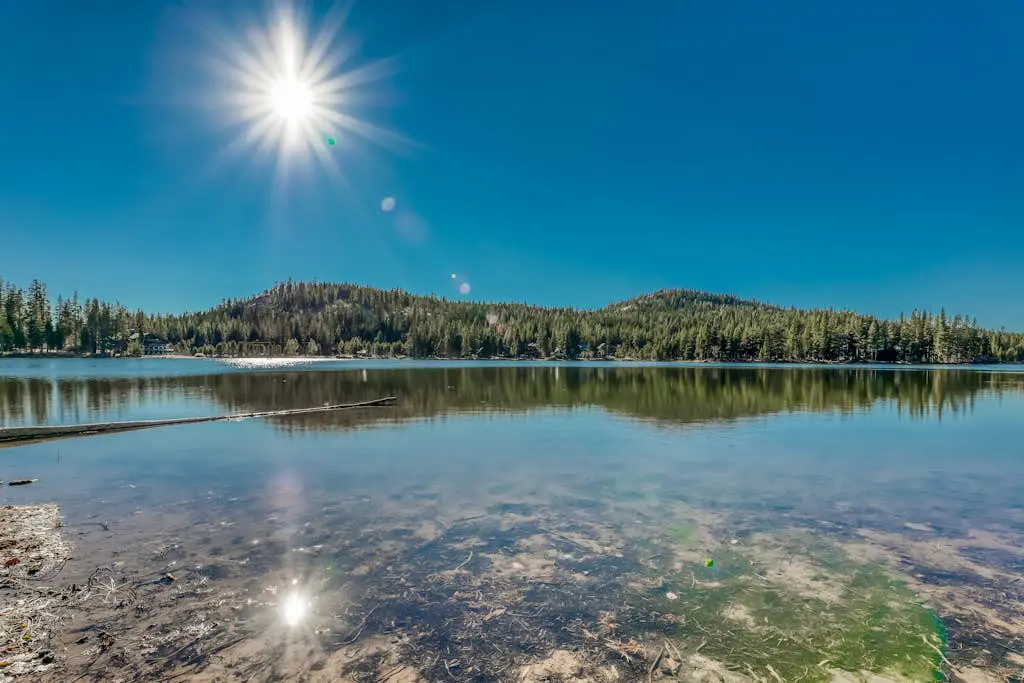 Family-friendly, lakefront getaway with a gas fireplace, furnished deck, & views