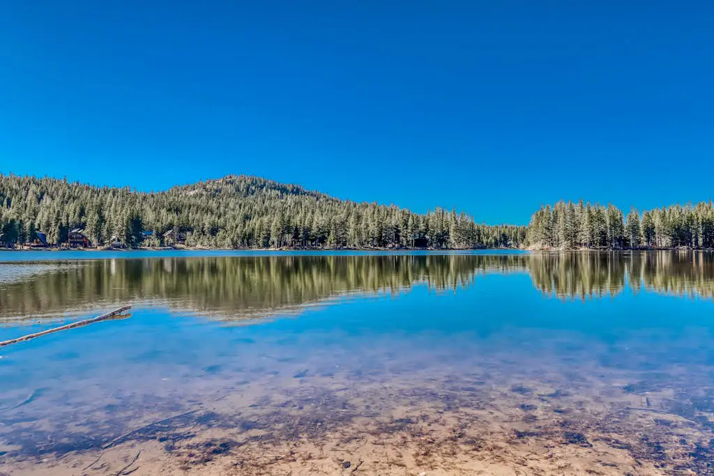 Family-friendly, lakefront getaway with a gas fireplace, furnished deck, & views