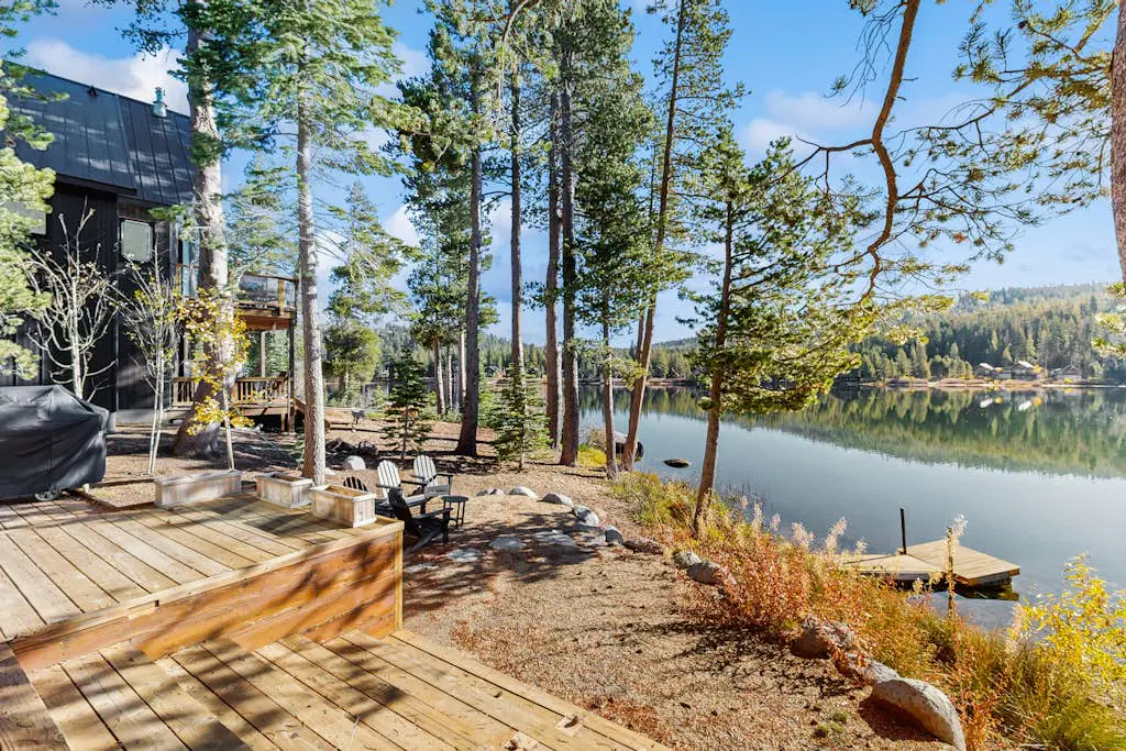 Luxury lakefront home with private hot tub, on-site dock, fireplace & HOA beach