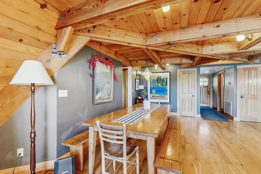 Luxury lakefront home with private hot tub, on-site dock, fireplace & HOA beach