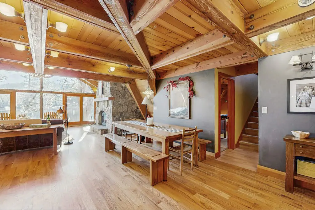 Luxury lakefront home with private hot tub, on-site dock, fireplace & HOA beach