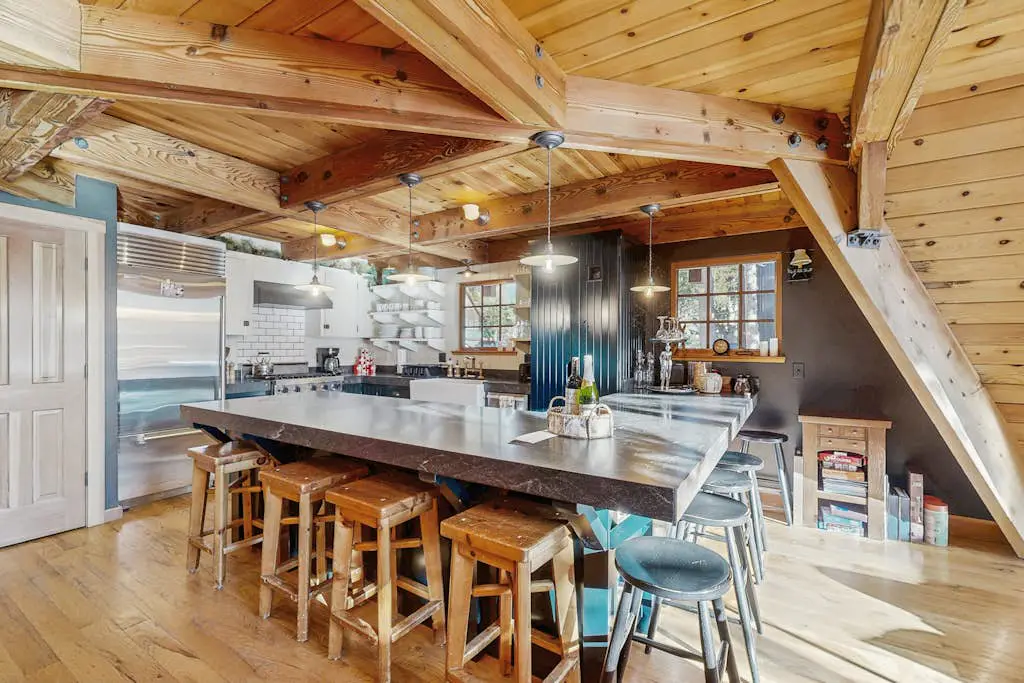 Luxury lakefront home with private hot tub, on-site dock, fireplace & HOA beach