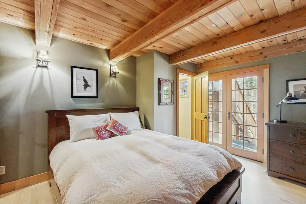 Luxury lakefront home with private hot tub, on-site dock, fireplace & HOA beach